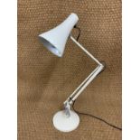A contemporary Anglepoise or similar desk lamp
