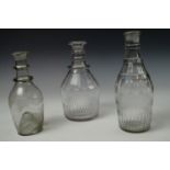 Three late Georgian glass decanters / cruets