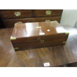 19th Century mahogany and brass bound rectangular fold-over writing slope with a fitted interior,