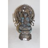 20th Century green / gilt patinated bronze figure of seated Buddha, 14.5ins high