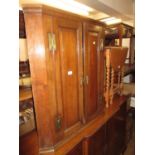 George III oak hanging corner cabinet with two fielded panelled doors and brass H hinges