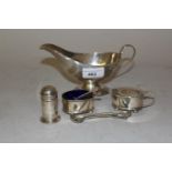 Birmingham silver pedestal sauce boat and a three piece silver condiment set