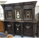 Large 19th Century Italian carved mahogany side cabinet, the shaped cornice and relief work frieze