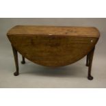 Large George II mahogany drop-leaf dining table raised on tapering supports with pad feet, 54ins