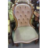 Pair of Victorian walnut and button upholstered ladies and gentlemans chairs, the shaped carved