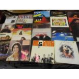 Two cases containing a collection of L.P. records, mainly 1970's and '80's including: Status Quo,