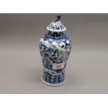 Chinese blue and white baluster form vase with cover, signed with four character mark to base, 8.
