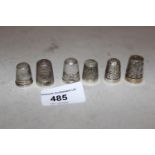 Six various silver thimbles