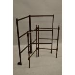 19th Century spindle turned folding towel rail, together with another later mahogany towel rail