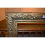 19th Century rectangular gilt moulded composition picture frame with relief floral decoration, 48.