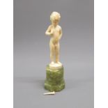 Ferdinand Preiss, small Art Deco carved ivory figure of a nude boy playing a horn mounted on an onyx