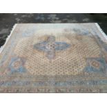Sparta carpet with a medallion and all-over design on an ivory ground with corner designs and