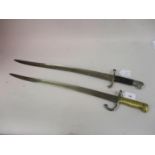 French 1872 pattern bayonet with brass grip together with a similar British bayonet