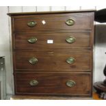 George III mahogany commode converted to two hinged doors, simulated as four drawers with oval brass