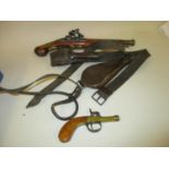 Small antique brass and steel muff or pocket pistol and a reproduction flintlock pistol, together