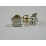 Pair of 18ct yellow and white gold screw back ear studs, each set with four princess cut diamonds,