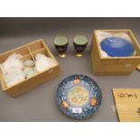 Japanese floral decorated shallow dish, two similar beakers (one at fault) and two boxed sets of