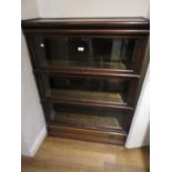 Globe Wernicke mahogany three section bookcase with bevelled glass doors and drawer to base, 34ins