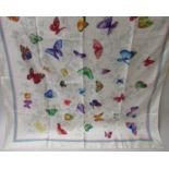Gucci, cream silk scarf with butterfly design, 34ins x 34ins together with another beige silk