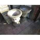 Pair of weathered cast concrete garden planters with pedestal bases, 20ins high 40cms diameter