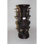 Large 20th Century Chinese dark patinated bronze baluster form vase with shallow relief