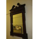 Edwardian mahogany wall mirror in Georgian style with a swan neck pediment above shell carved frieze
