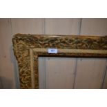 Large rectangular swept gilt picture frame, 45.5ins x 25ins rebate, together with five other various