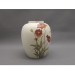 Poole pottery floral decorated baluster form vase Height is 22cms. Some rub marks to the body and