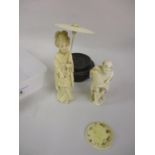 Late 19th Century Japanese carved ivory figure of a fisherman and another of a Geisha girl holding a