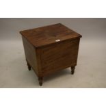 George IV mahogany black line inlaid wine cooler, the hinged lid above tapering sides and low turned
