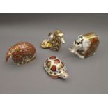 Royal Crown Derby paperweight in the form of an elephant, another of an armadillo, another of a