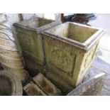 Set of four weathered cast concrete garden planters of rectangular form, relief decorated with Tudor