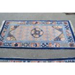 Pair of modern Chinese rugs with medallion and all-over design in shades of pink, blue and cream,