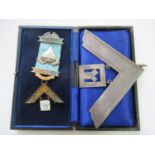 Silver Masonic set square together with a cased Masonic medal