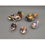 Three Royal Crown Derby paperweights in the form of ducks, together with two others similar of birds