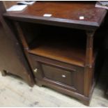 Late 19th Century mahogany bedside cabinet with alcove above a single panel door, together with a