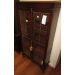 Early 20th Century oak two door bookcase with leaded glass, together with two modern oriental
