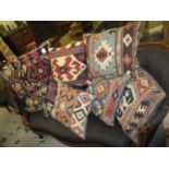 Group of nine various Kelim covered cushions