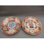Pair of large 19th Century Imari chargers decorated in conventional iron red, blue, green and