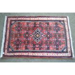 Small Hamadan mat with medallion and Herati design on a rose ground with borders, 3ft x 2ft