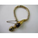 Victorian yellow metal articulated bracelet in the form of a snake, the head forming the clasp,