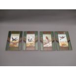 Set of four painted opaque glass panels decorated with birds within leaded glass borders, each 10ins