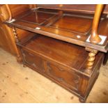 Early 20th Century oak monks bench, the fold-over top above barley twist uprights, the box base with