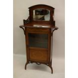 Edwardian Art Nouveau mahogany marquetry inlaid music cabinet with a mirrored back above a single