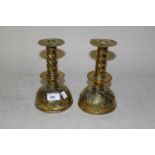 Pair of 17th Century Scandinavian embossed brass candlesticks with wide drip pans and dome shaped