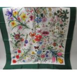 Gucci V. Accornero, floral silk scarf with emerald green border, 34ins x 34ins Some stains