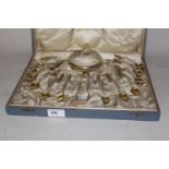 Cased German white metal (800 mark) caviar set comprising: twelve spoons, pair of tongs, small cut