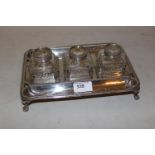 Edwardian silver three bottle inkstand, London 1910, maker W. and W., 20ozs troy excluding three