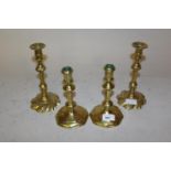 Pair of small 18th Century brass candlesticks, 8.5ins high together with a pair of similar smaller