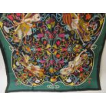 Gucci, green and black silk scarf with floral and musical design, 34ins x 34ins Slight staining